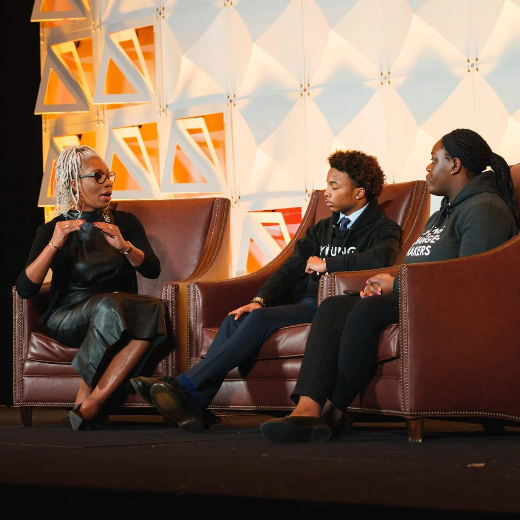 Young change makers speaking into microphone